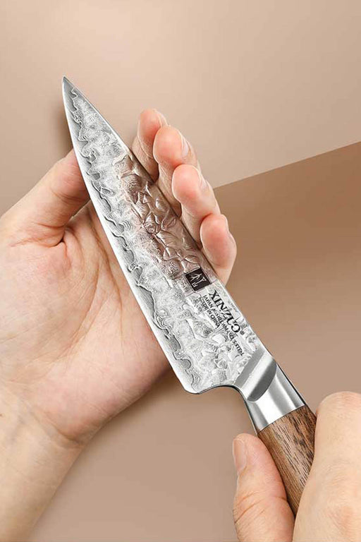https://www.thebambooguy.com/cdn/shop/files/Xinzuo-B46W-7-inches-Damascus-Utility-Knife-Genuine-Japanese-AUS-10-Steel_512x769.jpg?v=1701730507
